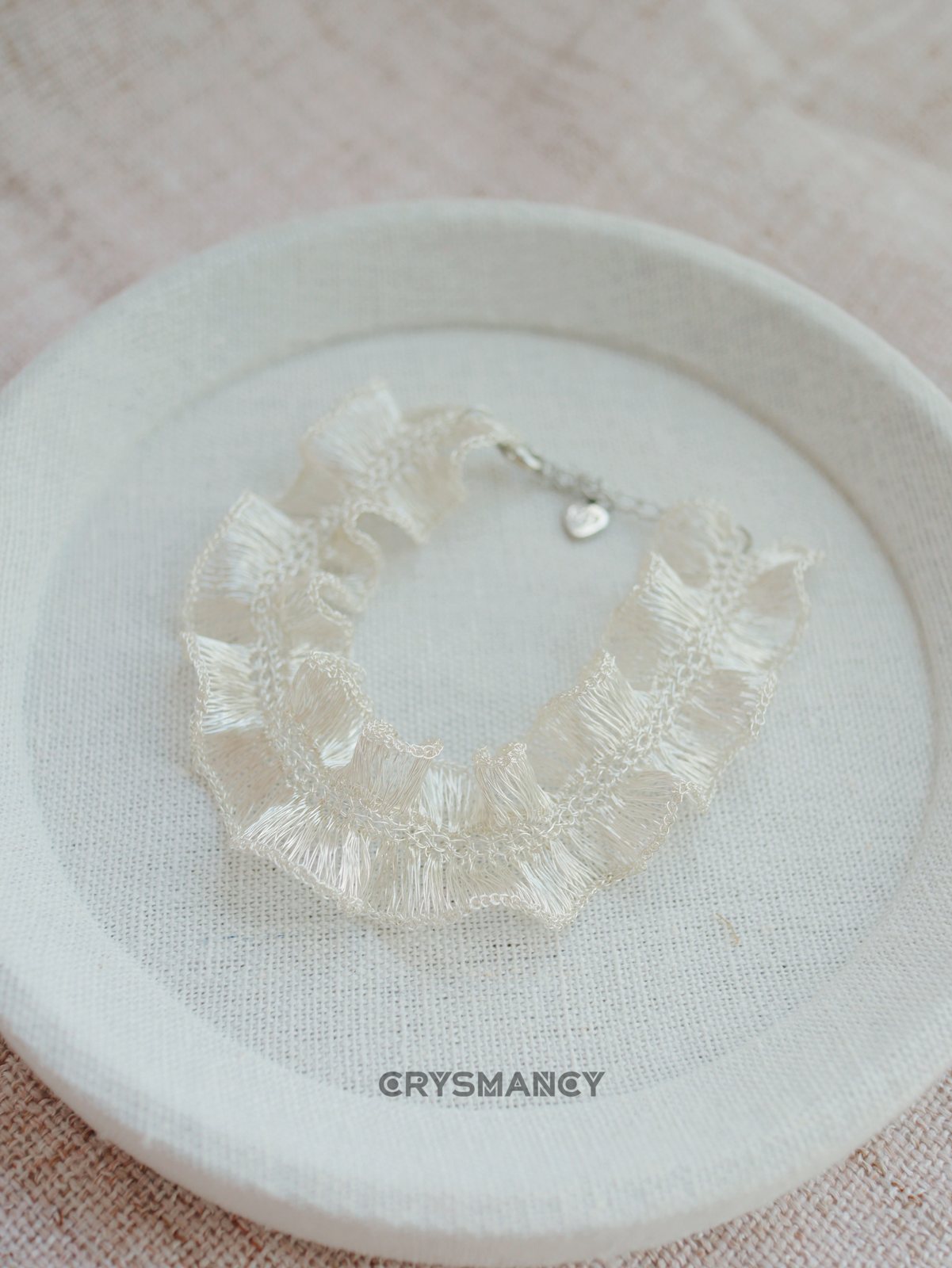 Close-up of a handwoven wire ruffle bracelet